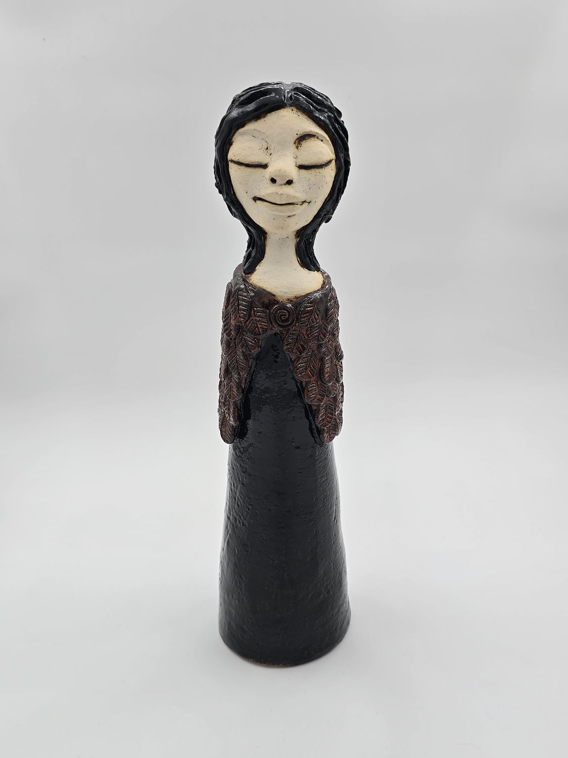 cloaked woman