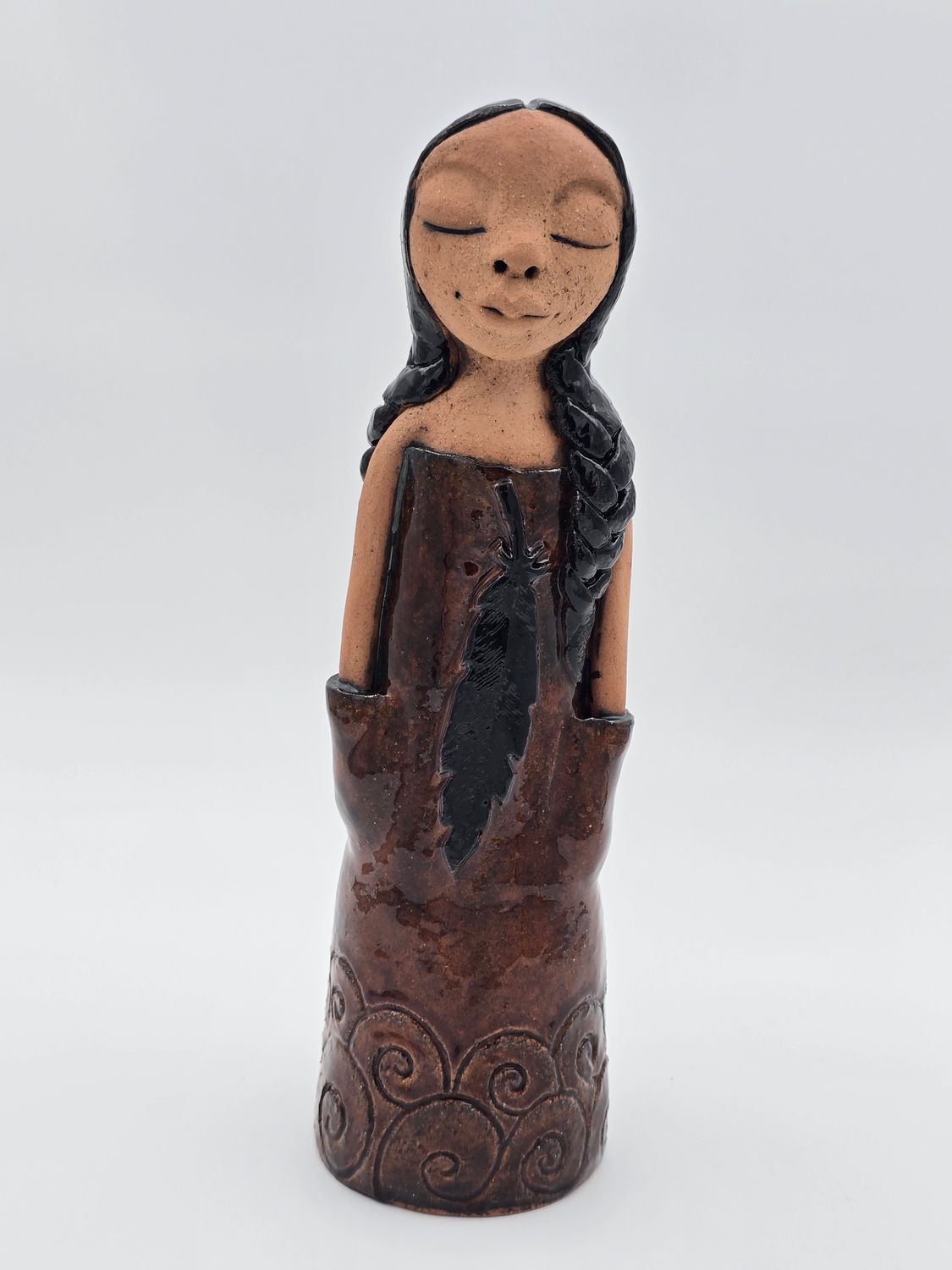 Brown lady with feather