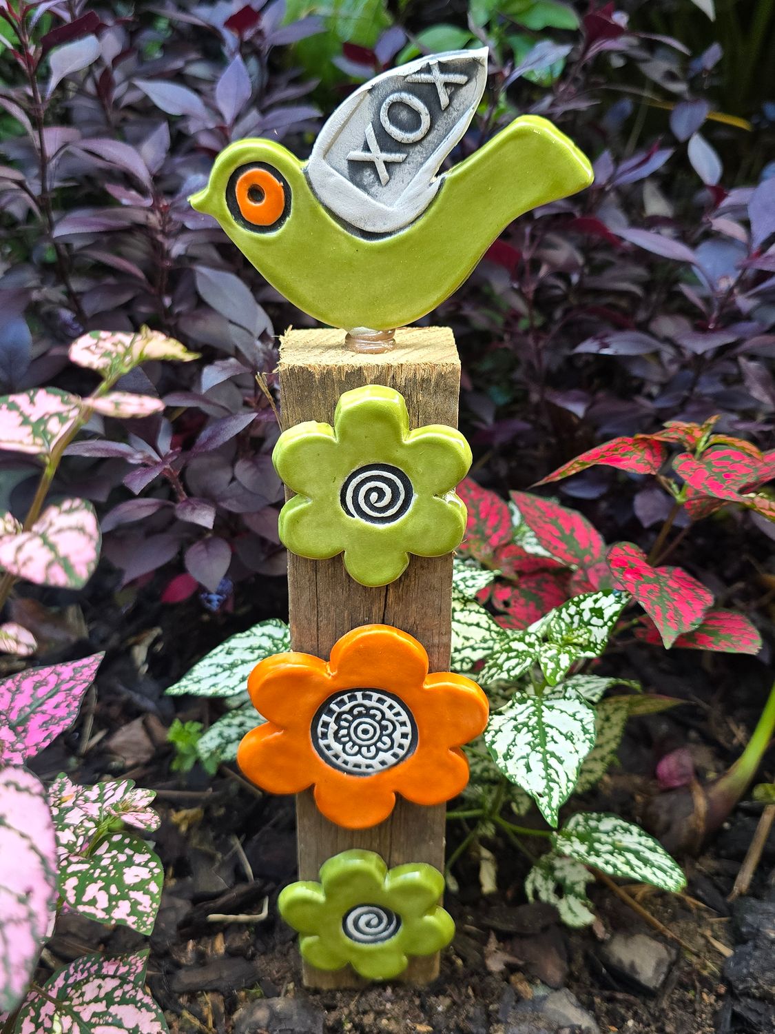 Green and orange flower  post