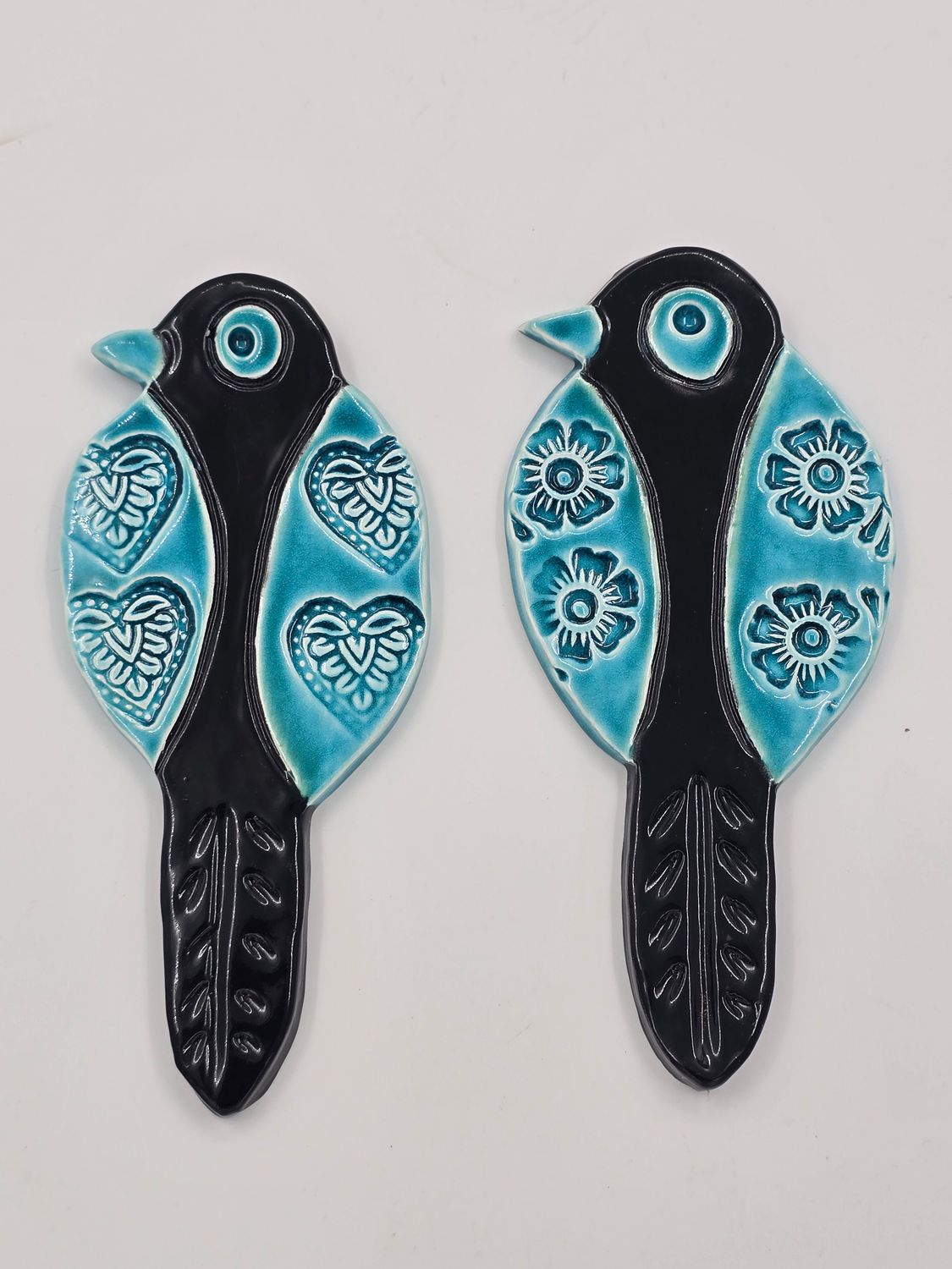 Aqua bird flower wings