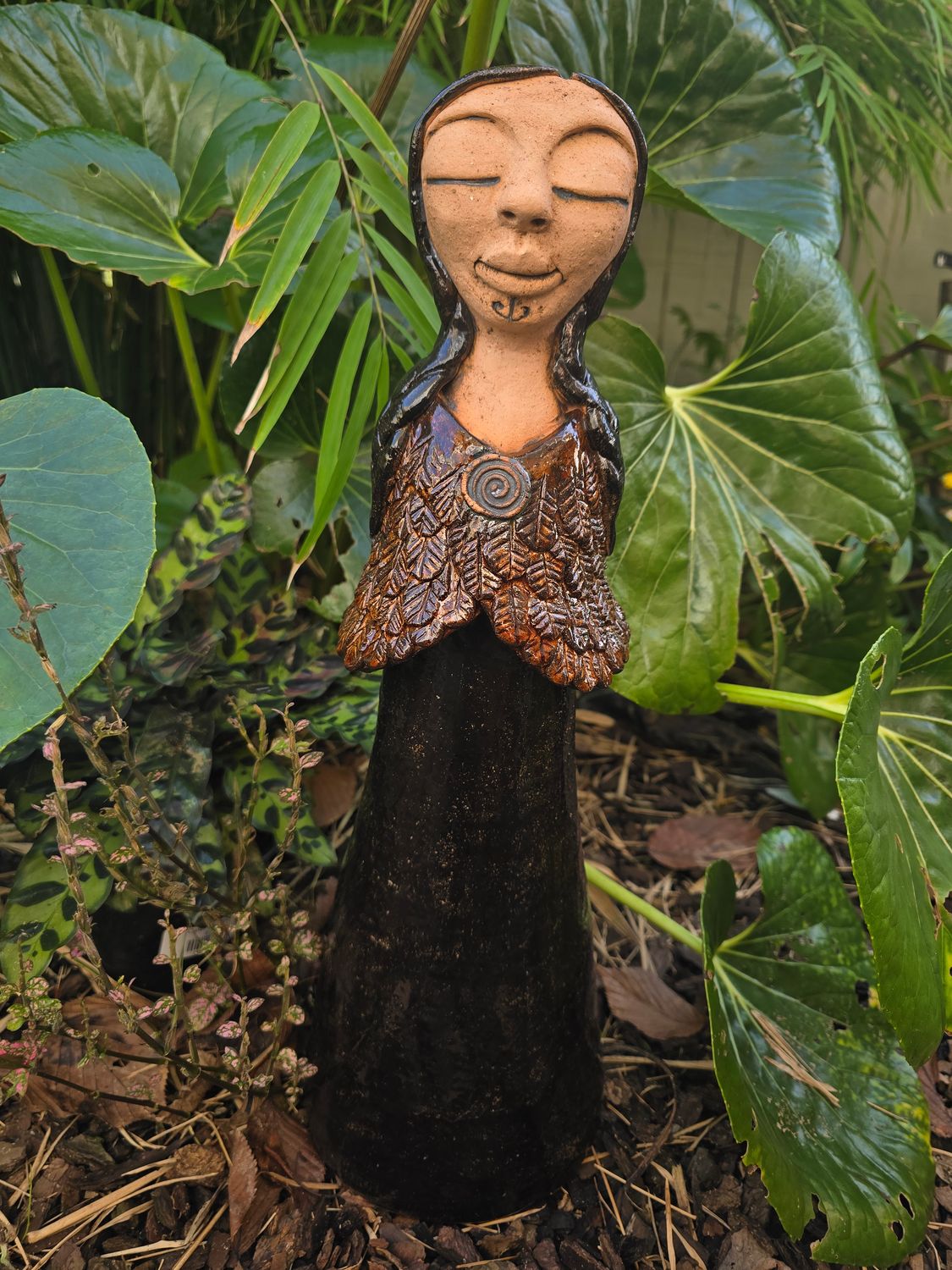 Cloaked  woman