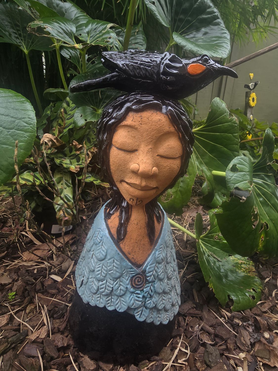 Bluish cloaked woman ,with huia