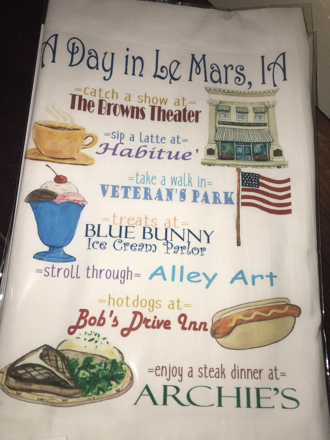 A Day In Le Mars Dish Towel