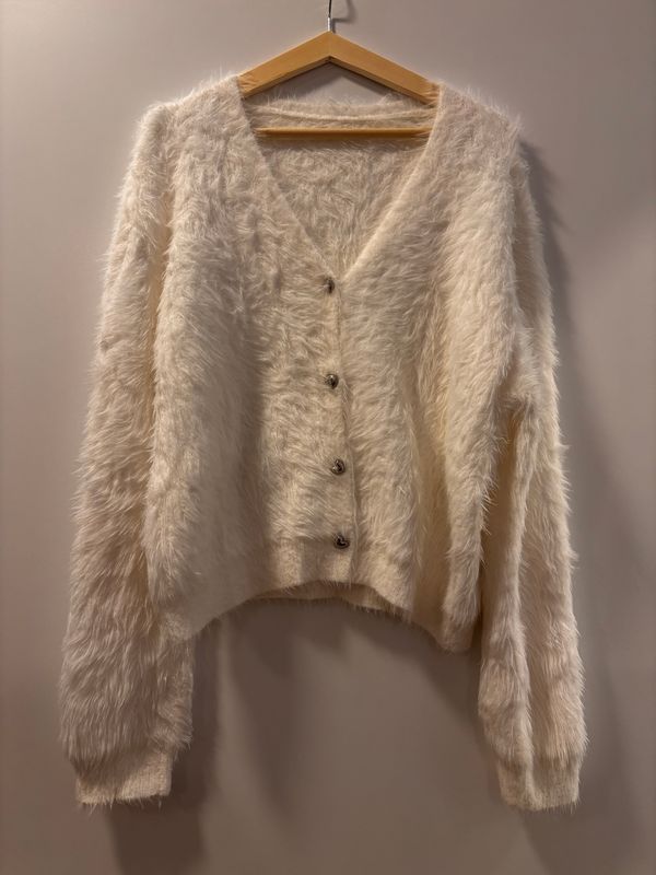 Vest met hart knoopjes.