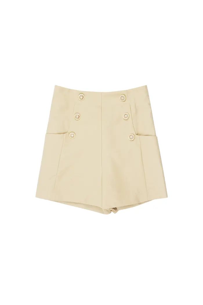 Shorts met gouden knopen.