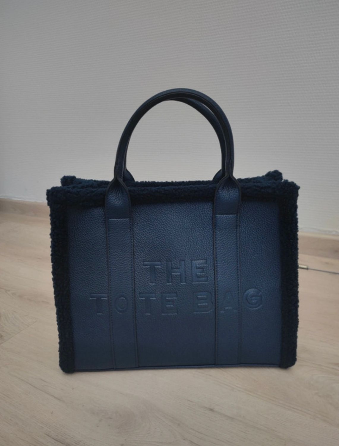 Totebag in kunstleder en teddy / Groot.