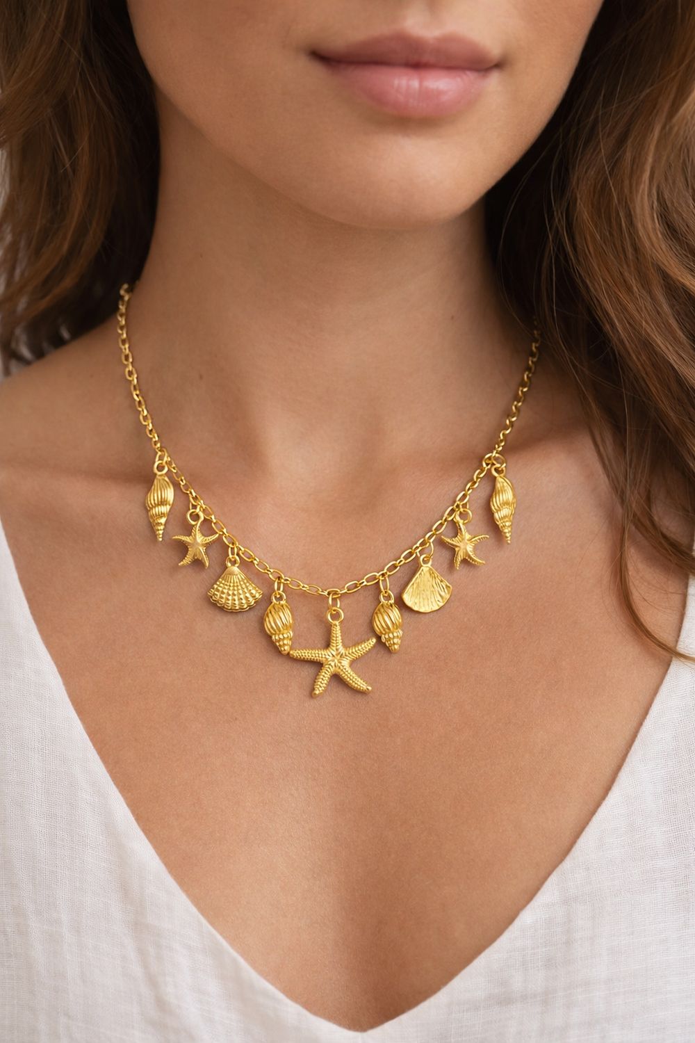 Gouden zeester &amp; schelp bedelketting.