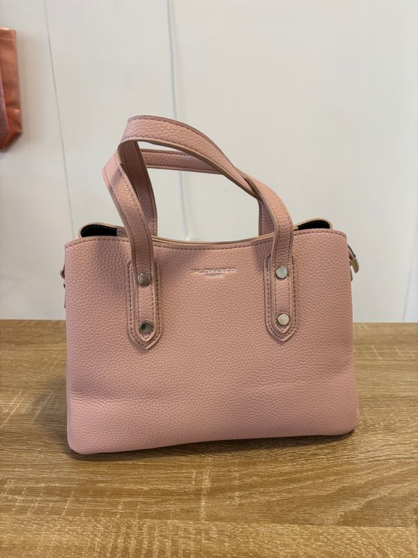 Elegante oudroze handtas.
