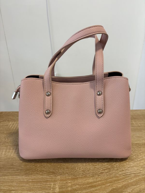 Elegante oudroze handtas.