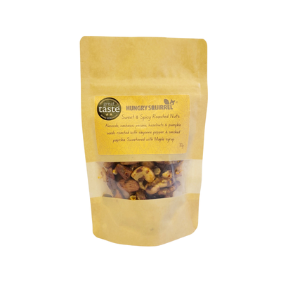 70g pouch of Hungry Squirrel Sweet &amp; Spicy Roasted Nuts – compact, recyclable packaging with visible nut mix.