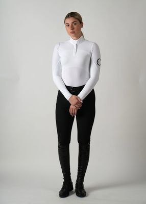 Model wearing the Ava competition top with long sleeves and perforations for better ventilation.