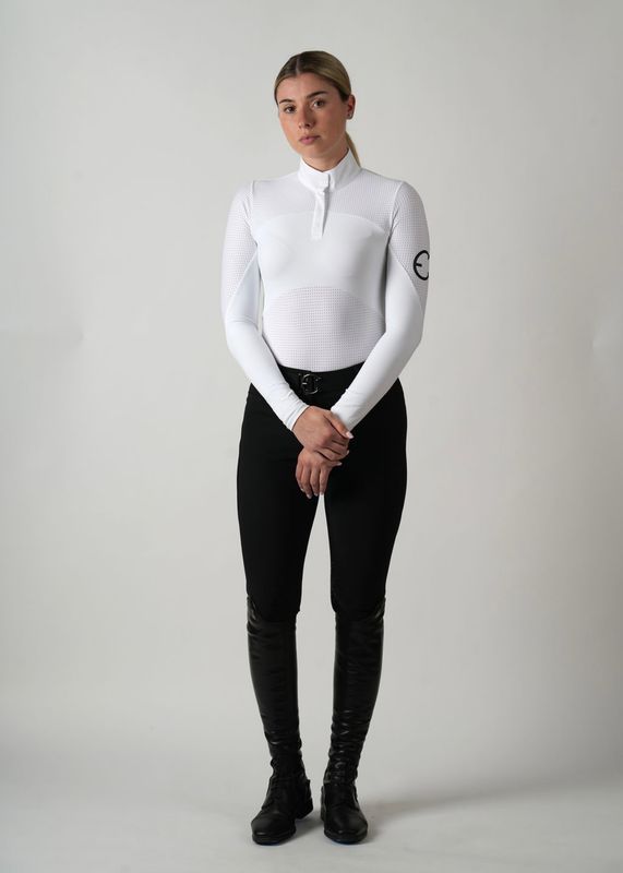 Model wearing the Ava competition top with long sleeves and perforations for better ventilation.