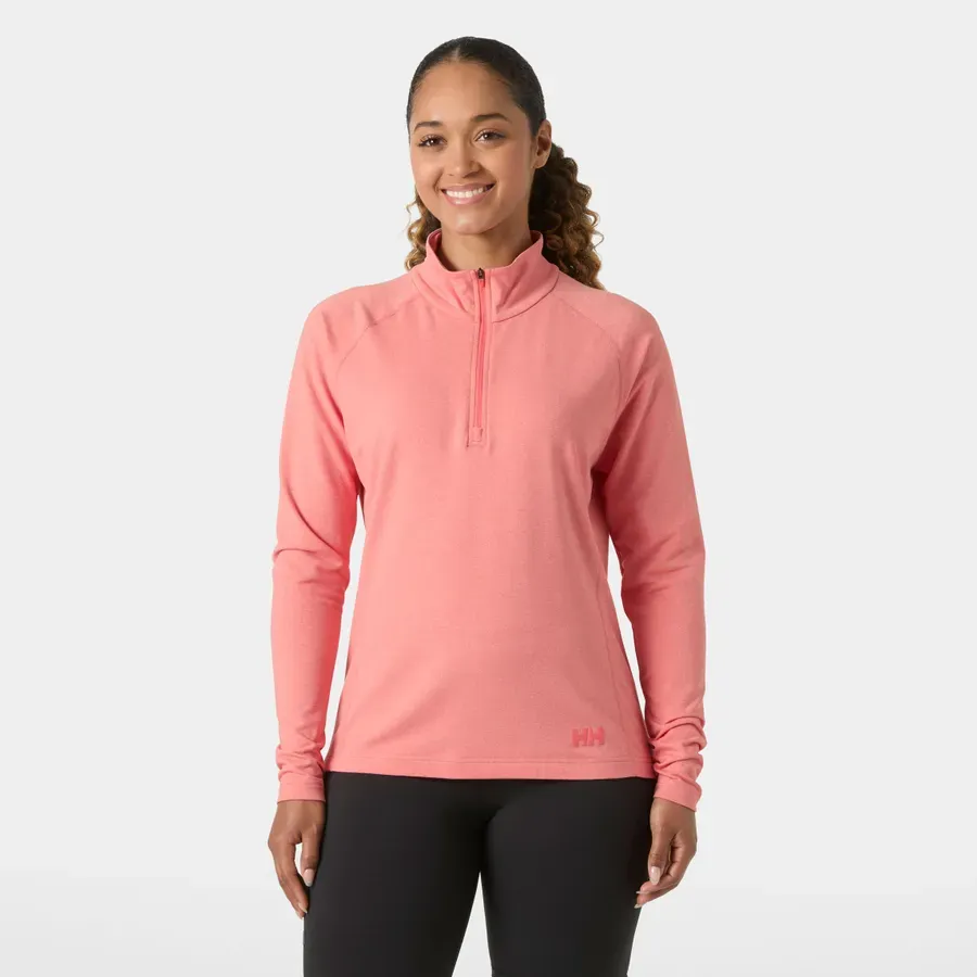 Model wearing the Tyri knit long-sleeved half-zip sweater in sunset pink