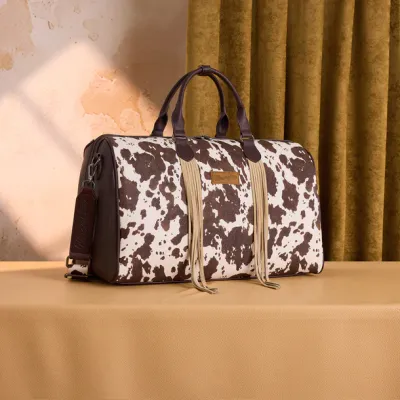 WRANGLER - Cow Print Fringe Duffle Bag
