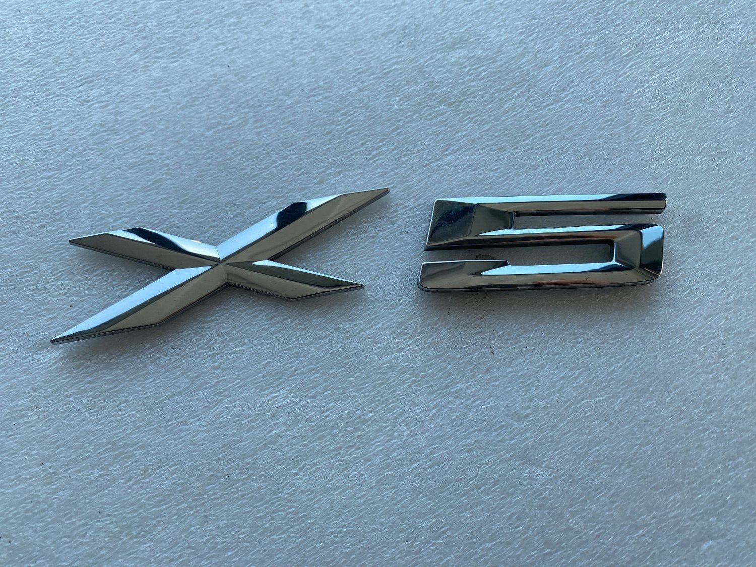 GENUINE BMW - E53 E70 Rear Trunk Emblem Adhered 51148402675