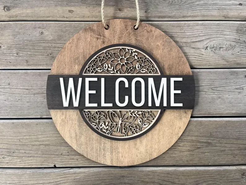 Round Interchangeable Welcome Sign with Patented Slide & Lock System - Includes 4 Seasonal Inserts"
