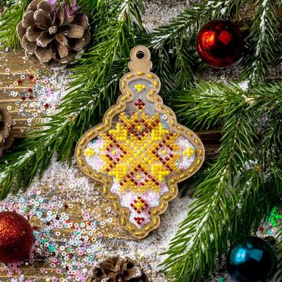 Yellow Christmas tree toy by Wonderland Crafts Christmas Bead embroidery kit on a plastic base