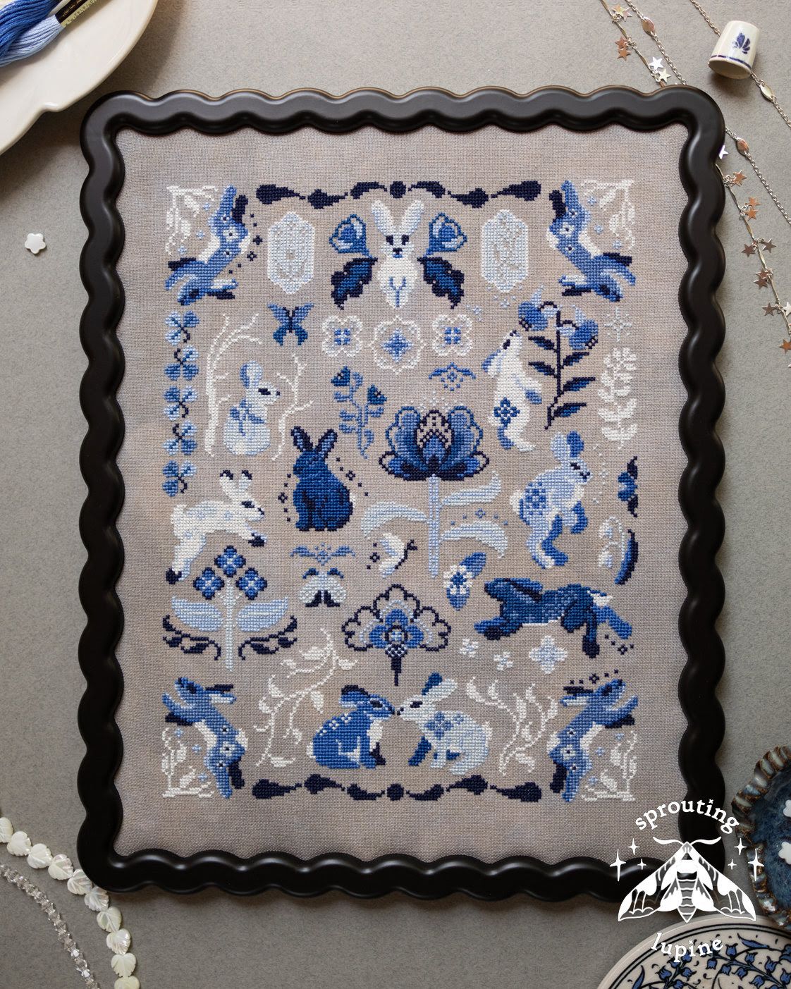 Delft Bunnies by Sprouting Lupine Exclusive Needlework Marketplace 2026 Printed counted cross-stitch pattern