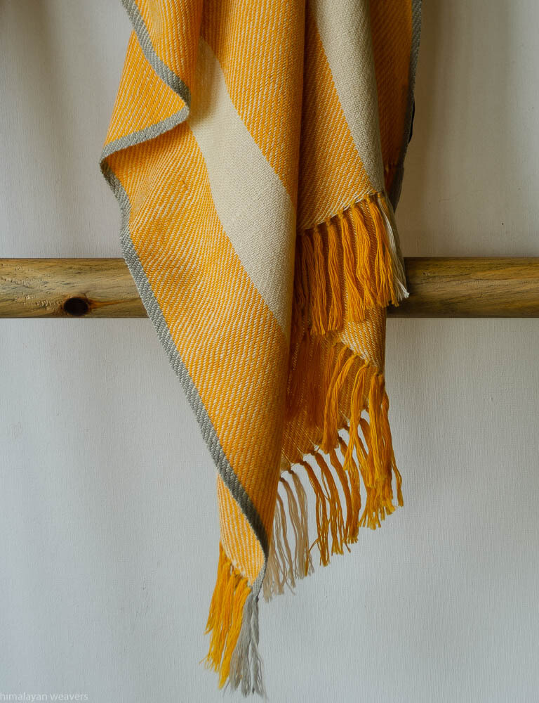 Hand-woven woolen stole dyed with tesu flowers and harada