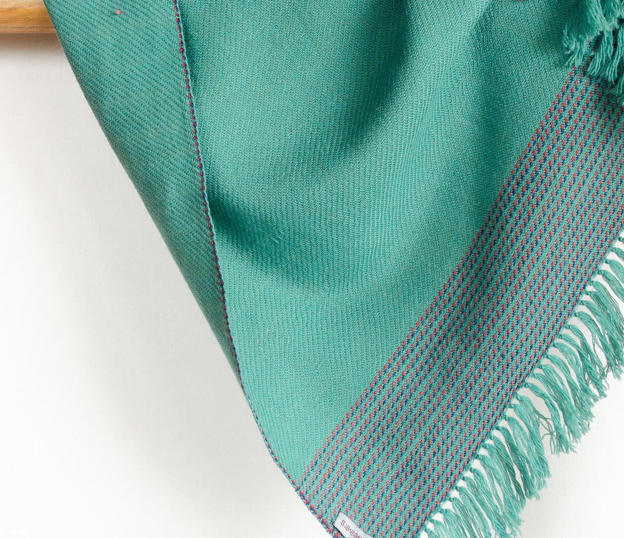 Hand-woven woolen stole dyed with indigo, tesu flowers and sappanwood