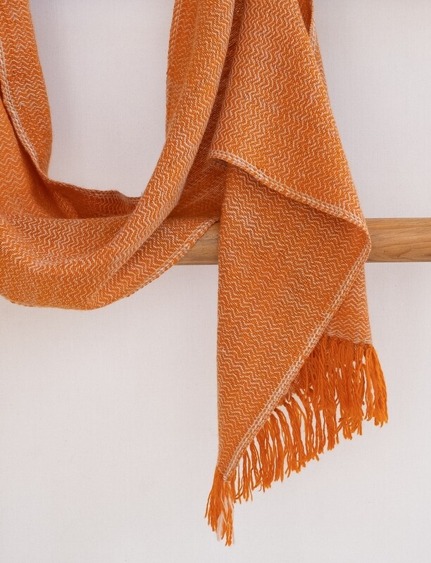 Scarf woven with handspun wool dyed with tea and tesu flowers and