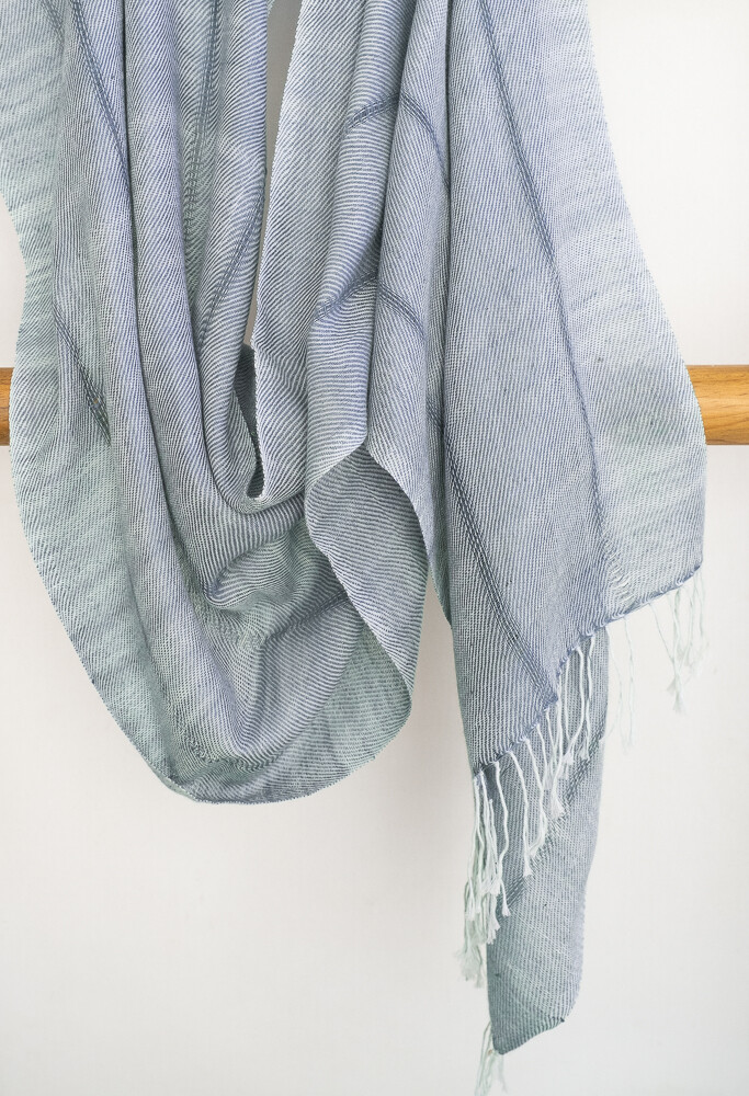 Hand-woven cotton and eri-silk stole dyed with indigo and tesu flowers