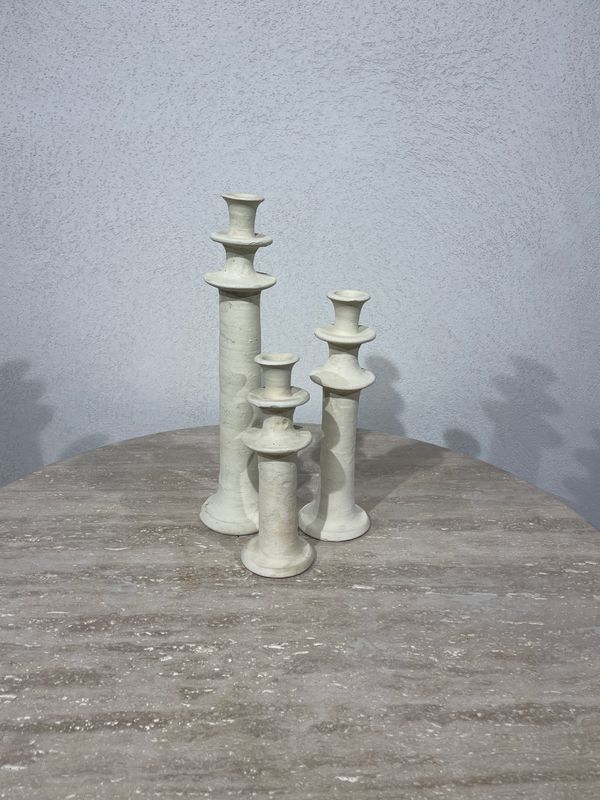 Set van 3 stenen kandelaars