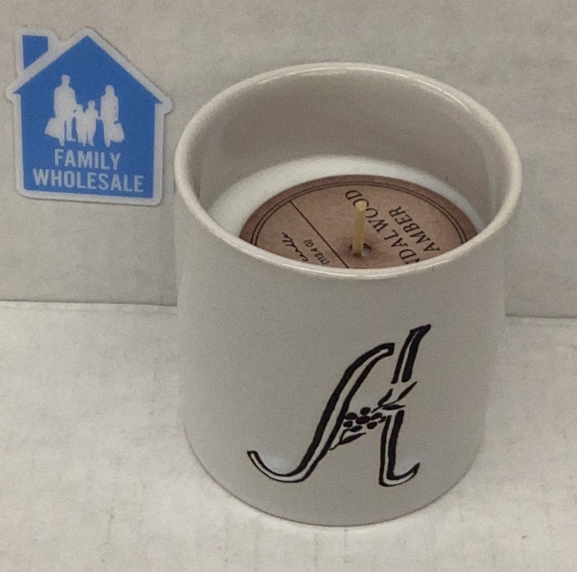 A Sandlewood Amber Scented Candle