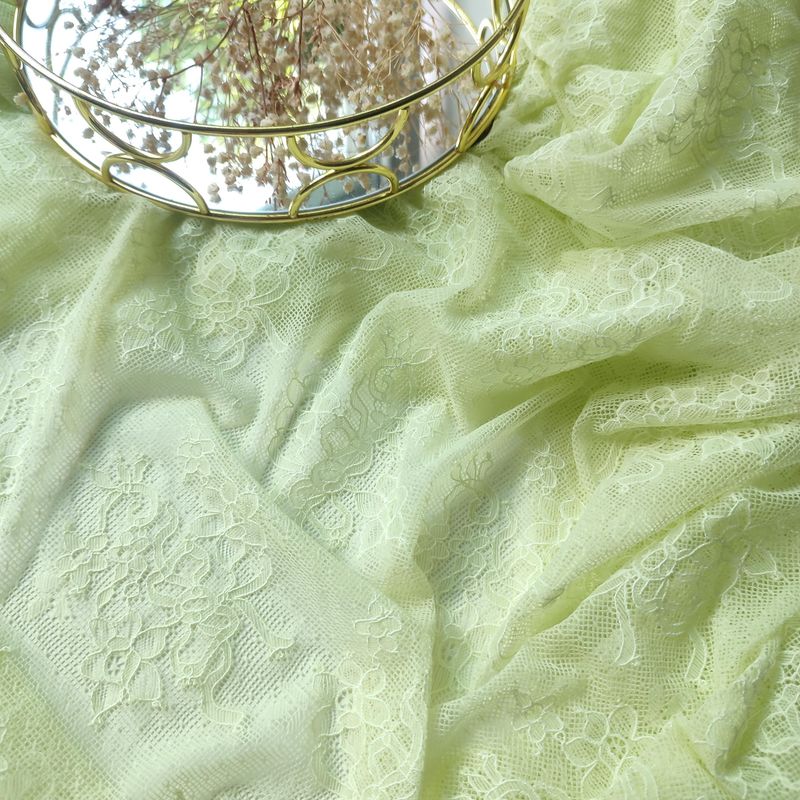 Light green Italian stretch lace fabric with floral texture