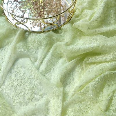 Light green Italian stretch lace fabric with floral texture