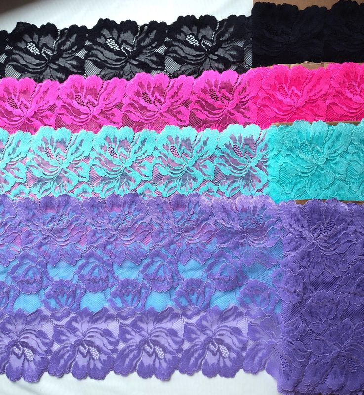 Colorful wide stretch lace with floral pattern in multiple bright colors

