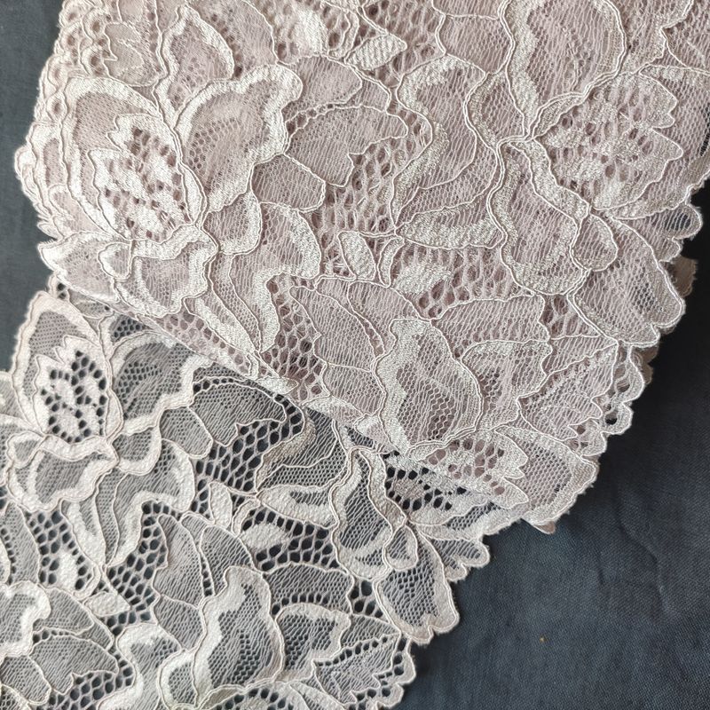 Stretch lace in dusty rose, burgundy, and white with floral patterns

