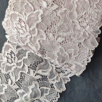 Stretch lace in dusty rose, burgundy, and white with floral patterns


