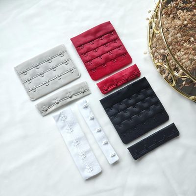 Wide hook and eye closures in black, white, red, and beige for lingerie sewing

