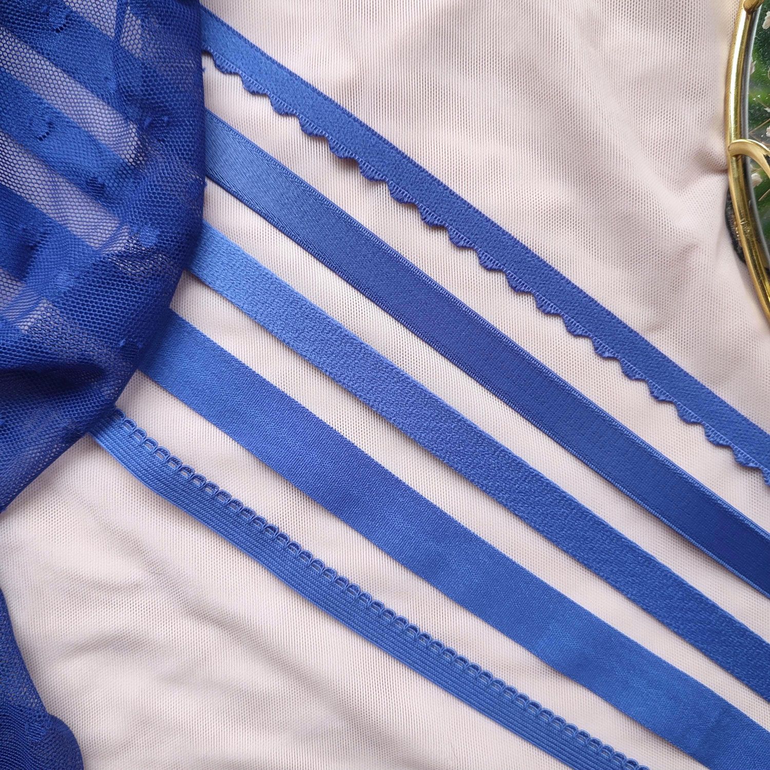 Cornflower blue lingerie elastics in assorted types and widths


