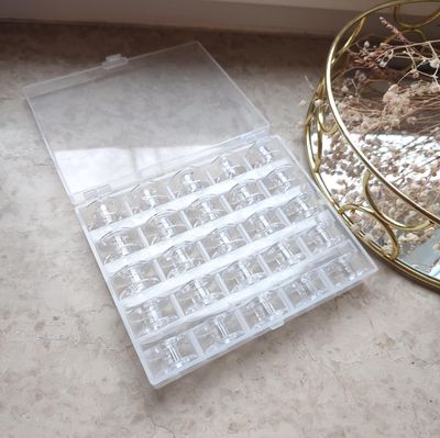 Bobbins holder+ 25 plastic bobbins