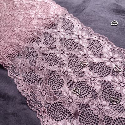 Dusty pink stretch lace with scalloped floral design

