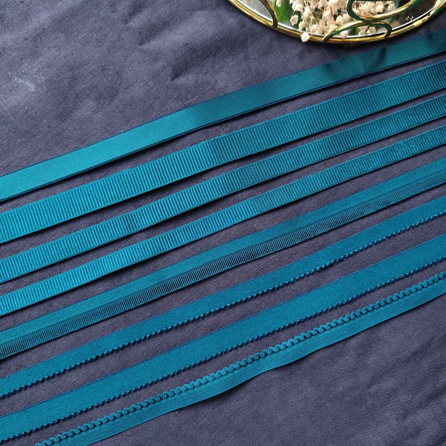 Teal lingerie elastics in various widths and styles

