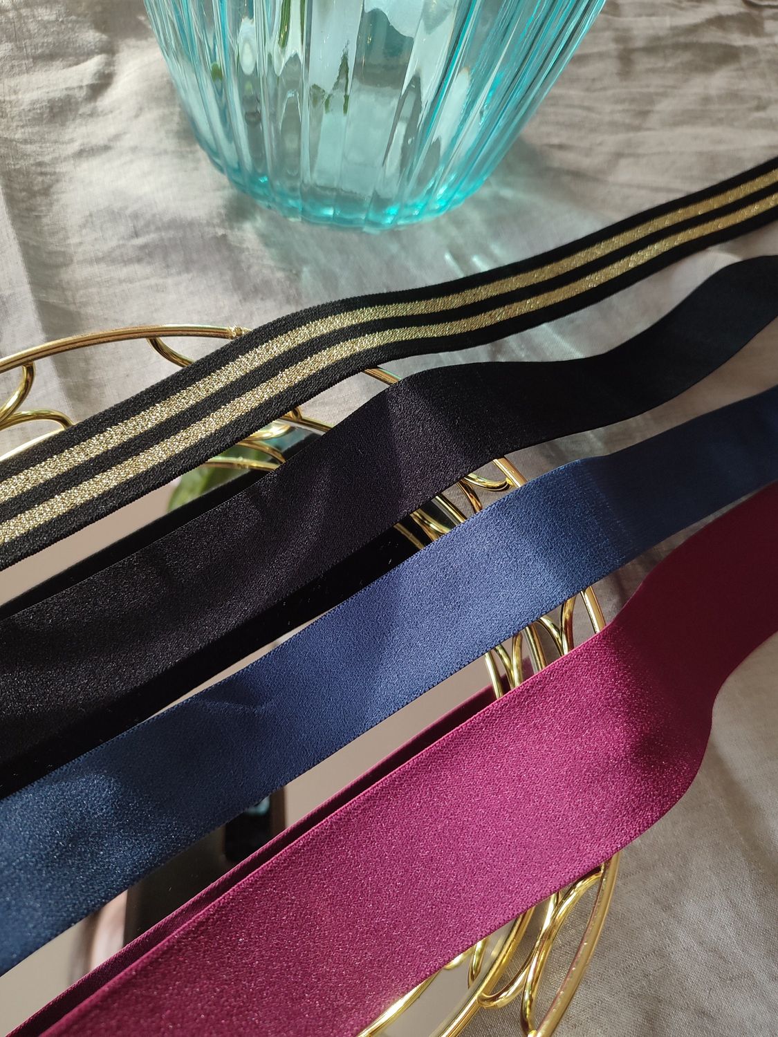Shiny elastic bands in black, blue, pink and striped gold for lingerie sewing

