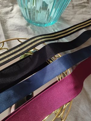 Shiny elastic bands in black, blue, pink and striped gold for lingerie sewing

