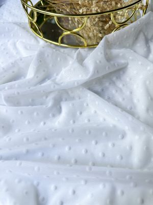 White stretch mesh with flocked dots for lingerie sewing

