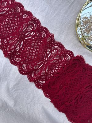 Burgundy stretch lace for sewing lingerie with bold textured pattern

