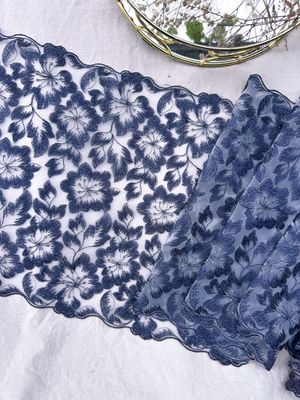 Navy floral embroidery lace with silver accents on white mesh

