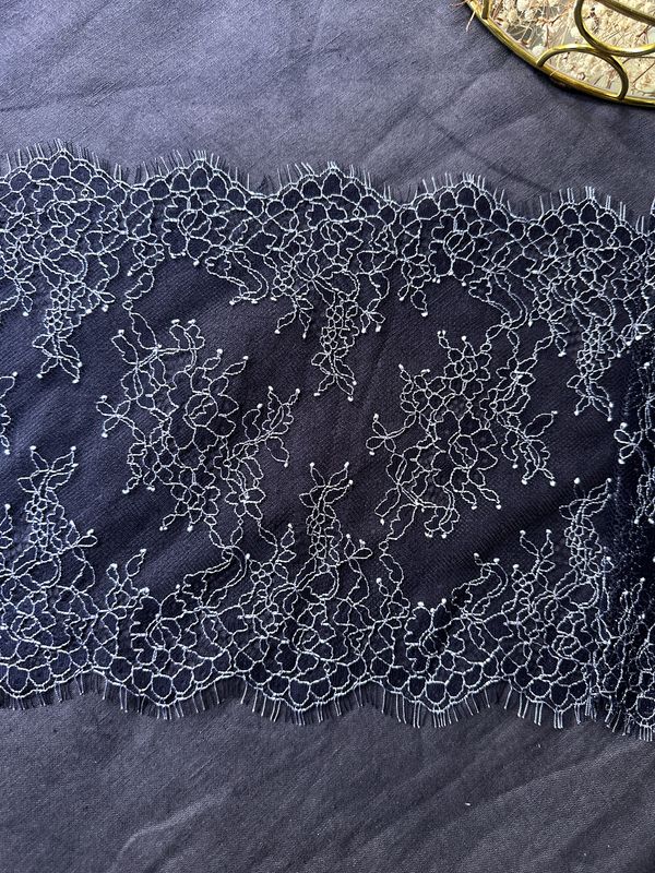 Dark navy Chantilly lace with ecru embroidery, 22 cm wide

