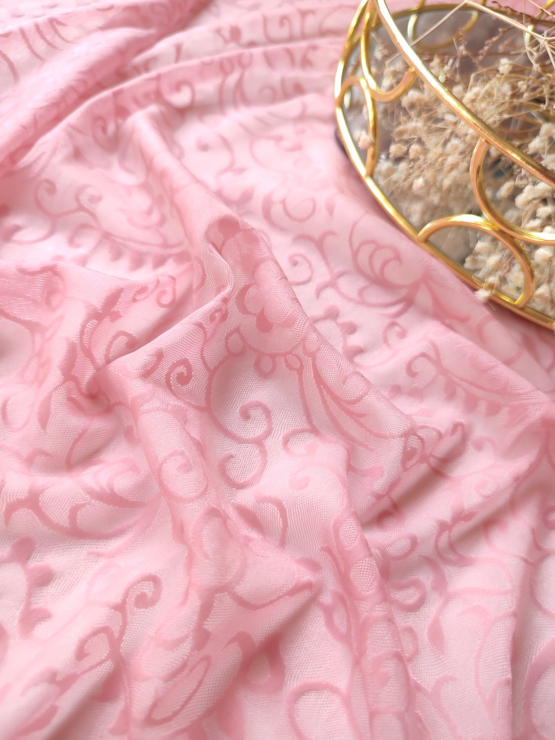 Pink stretch mesh with swirling pattern