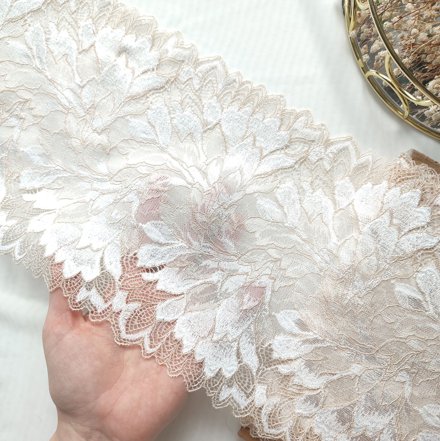 Ivory stretch lace, two-tone floral design with scalloped edges, 20 cm wide