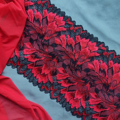Red and black stretch lace with floral pattern, 20 cm wide, for lingerie sewing.