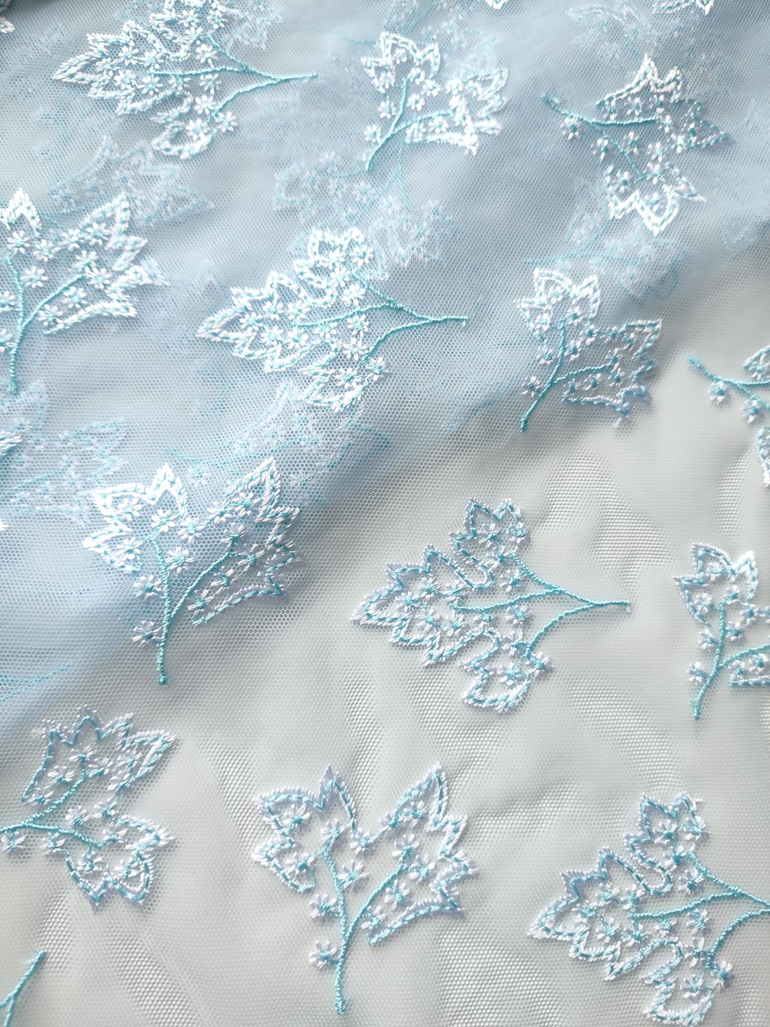 Light blue embroidered tulle for lingerie and dressmaking