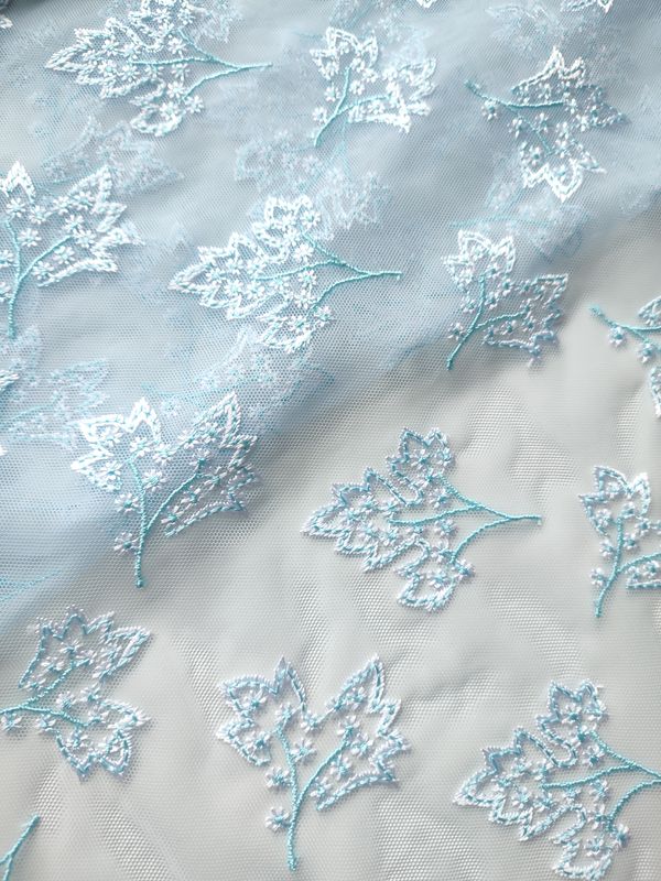 Light blue embroidered tulle for lingerie and dressmaking
