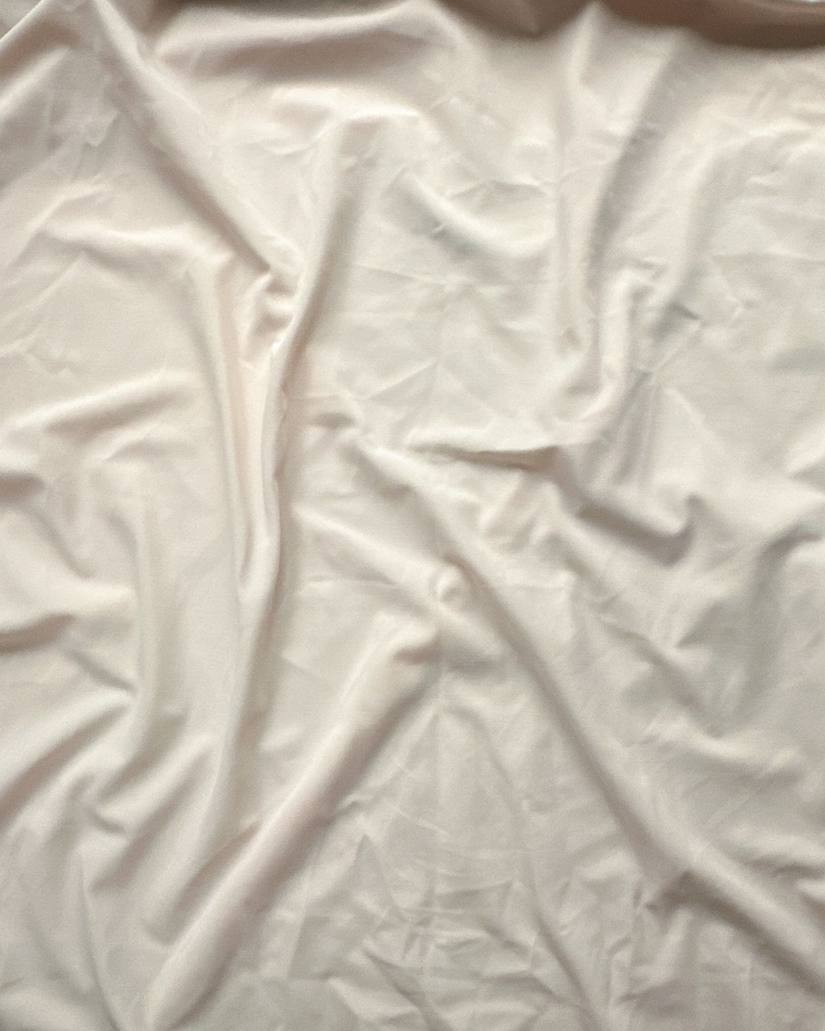 Soft cream stretch microfiber fabric — smooth matte surface